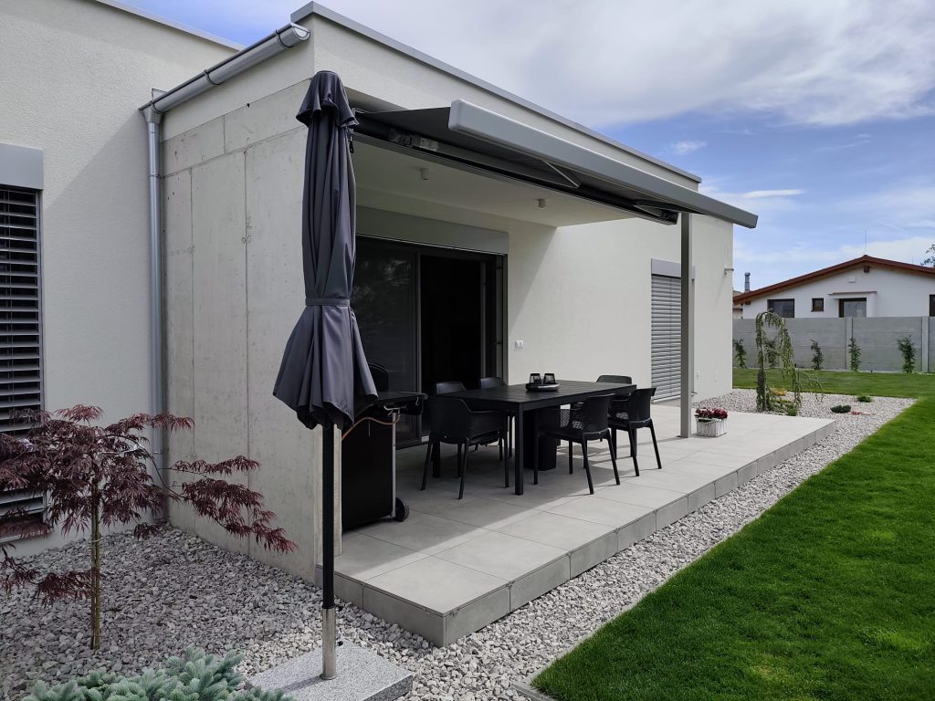 Raised patio with matching paving along the edge